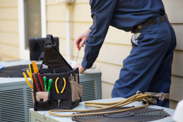 Exterior central AC unit being repaired