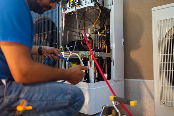 Hvac technician checking refrigerant levels