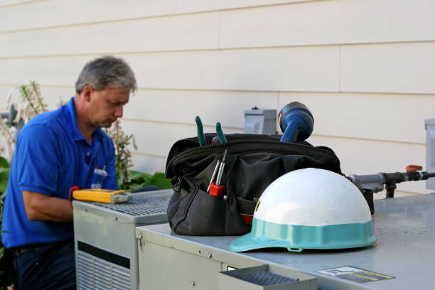 Man working on AC unit